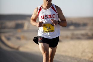 man in white jersey while running