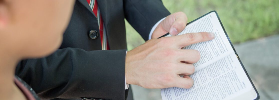 a close up of a person writing on a book