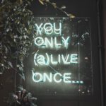 a neon sign that says you only alive once
