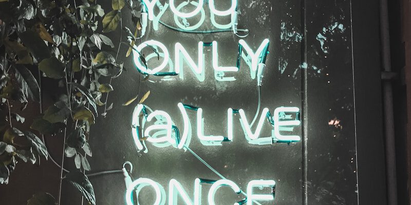 a neon sign that says you only alive once