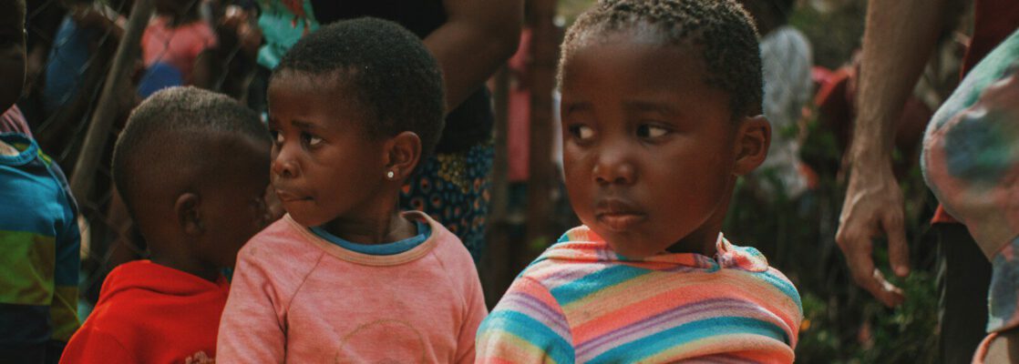 a group of young children standing next to each other