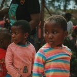a group of young children standing next to each other